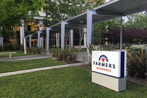 Farmer's Insurance sign in front of building
